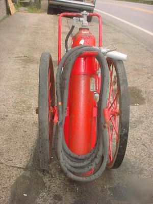Vintage industrial wheeled ansul fire extinguisher