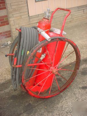 Vintage industrial wheeled ansul fire extinguisher
