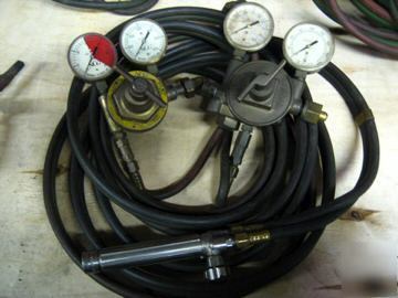 Oxy-acetylene regulators with aprox. 25 feet of hose
