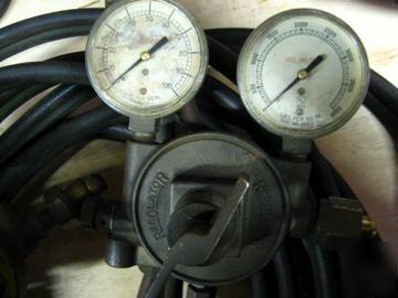 Oxy-acetylene regulators with aprox. 25 feet of hose